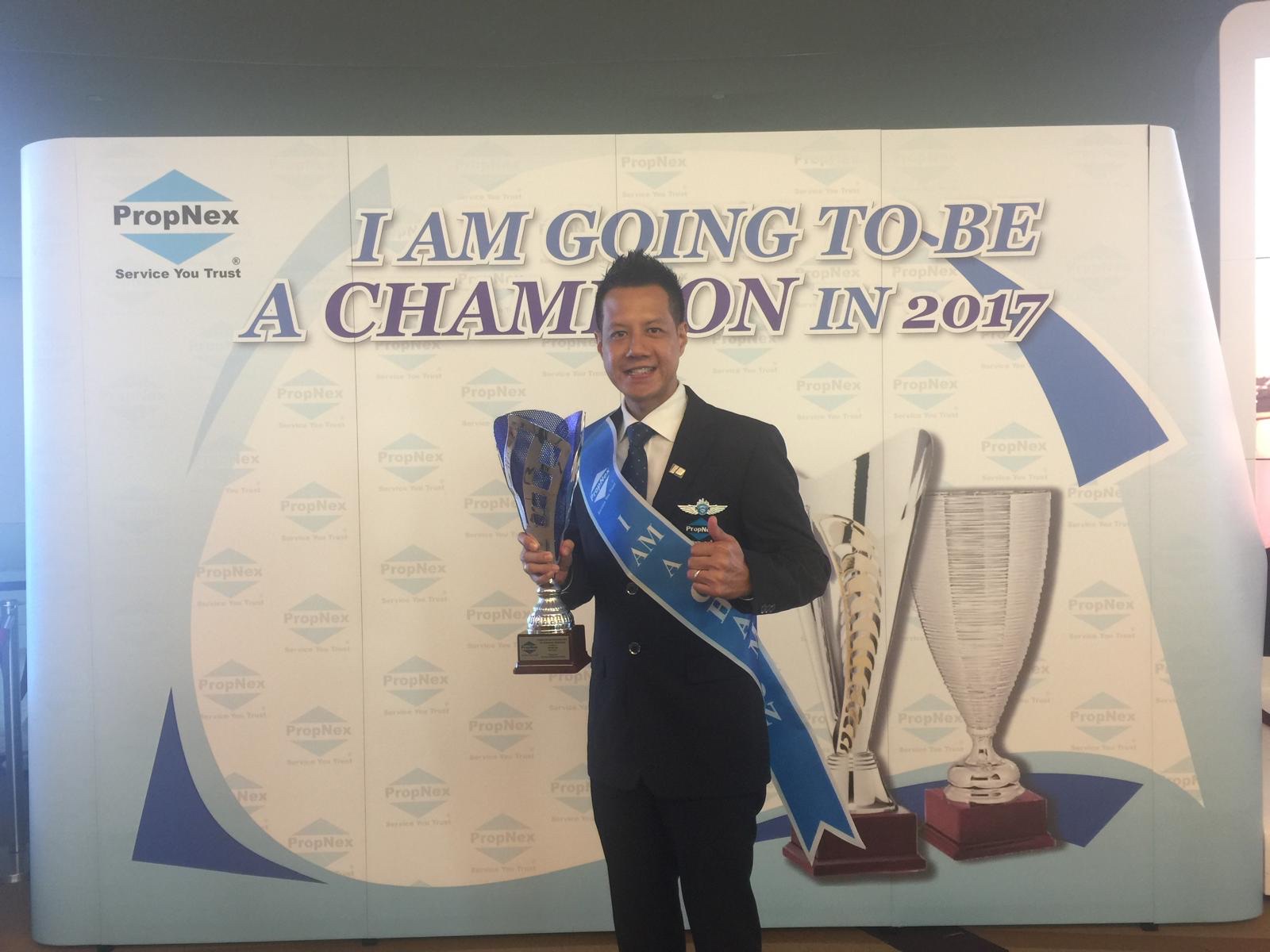 Adrian Lim on stage at the 2017 PropNex Champion convention